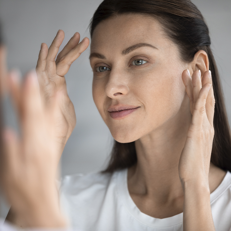 Woman cleaning her face